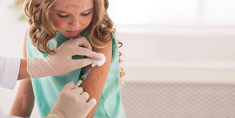 Vaccination Concept. Girl Receiving Measles Vaccine In Clinic, Copy Space