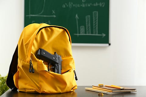 backpack gun school teen