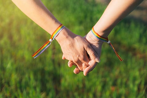 lesbians hands rainbow