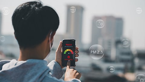 Man checking PM2.5 levels