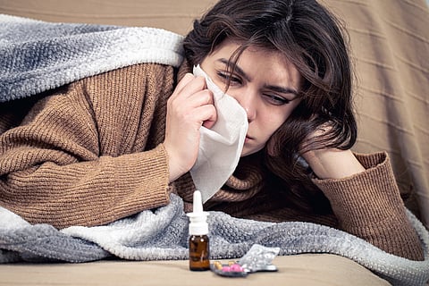 woman sick cold flu influenza