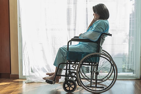 Middle-aged woman in wheelchair, multiple sclerosis