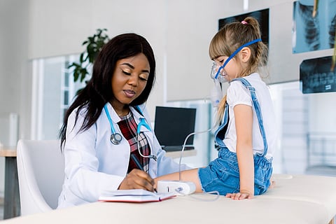 little girl receiving asthma treatment