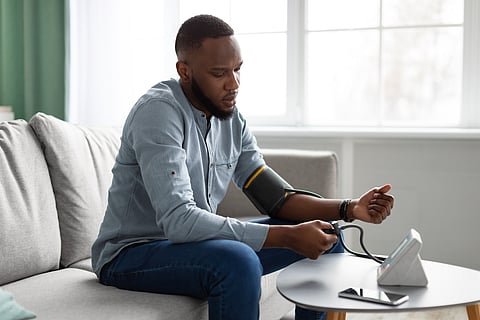 man taking his own blood pressure