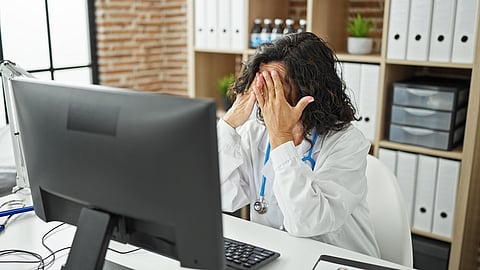 Middle age hispanic woman doctor working stressed at the clinic