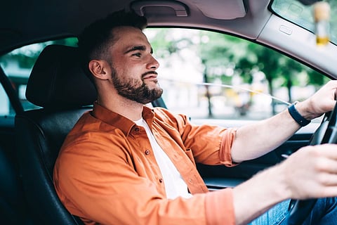man driving car motor vehicle