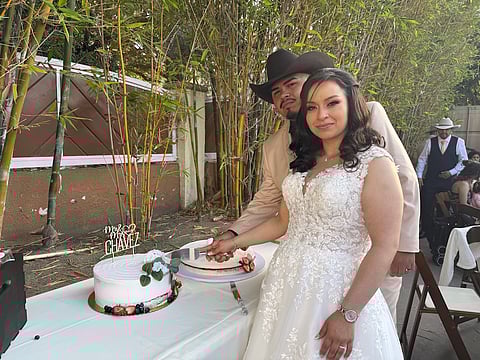 Ariana Pulido (right) and Jeffrey Chavez cut the cake at their wedding. Photo courtesy of Ariana Pulido.