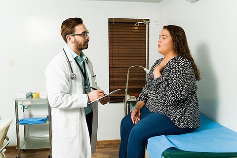 woman with obesity talking to doctor