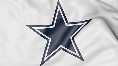 Close-up of waving flag with Dallas Cowboys NFL American football team logo