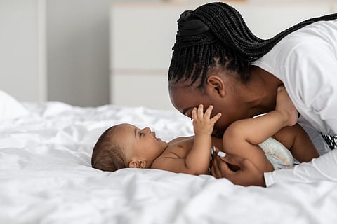 infant black diaper mom motherhood