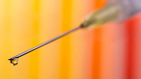 vaccination with serum and syringe