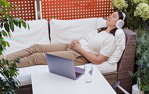 Young woman having online hypnotherapy regression session