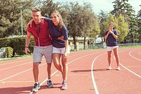 young athlete injured to knee on the track