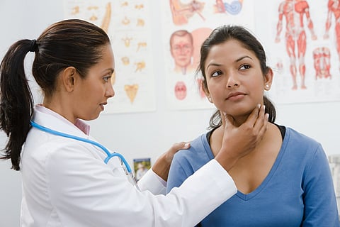 A doctor examining woman