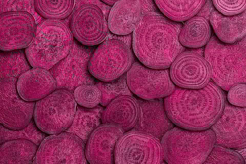 Background of heap fresh colorful beetroot slices