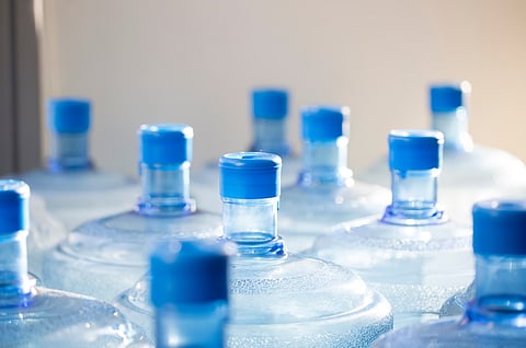 Closeup of big empty bottle of water waiting for recycling
