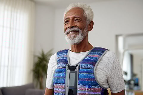Senior Man in Weighted Vest at Home Gym, Inspiring Health and Wellness Lifestyle