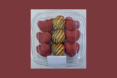 A photo of the recalled Madeleines on a deep red background.