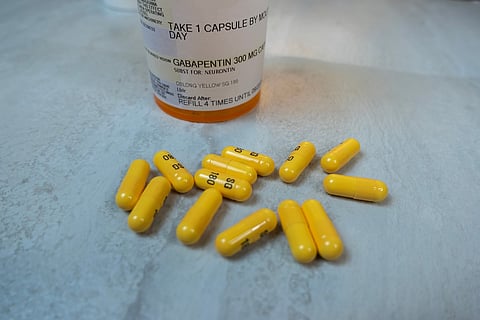 Seattle, WA USA - circa November 2022: Selective focus on Gabapentin medication on a light colored background.