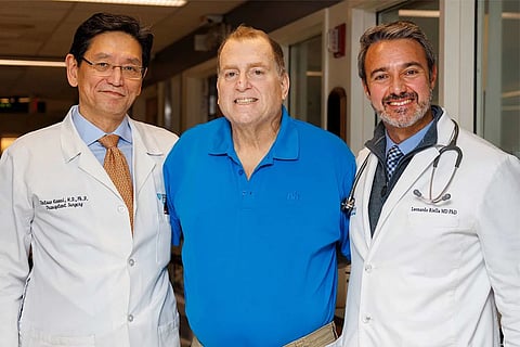 Tim Andrews (center) with surgeons from Massachusetts General Hospital
