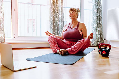 Relaxation exercise in lotus position, for overweight adult women with large breasts