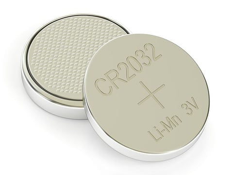 Two button cells, 3D rendering isolated on white background