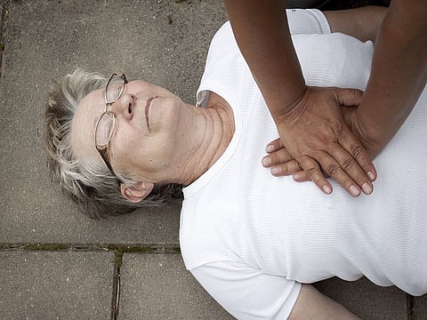 A senior lade with cardiac arrest or stroke receiving cpr