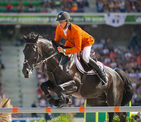 Jeroen Dubbeldam MM-kilpailuissa Cortes C:n selässä.