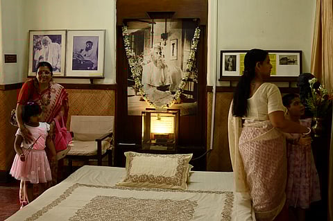 A group of women and children observe the a room at the Jorasanko Thakurbari museum in Kolkata, the ancestral house of Rabindranath Tagore.