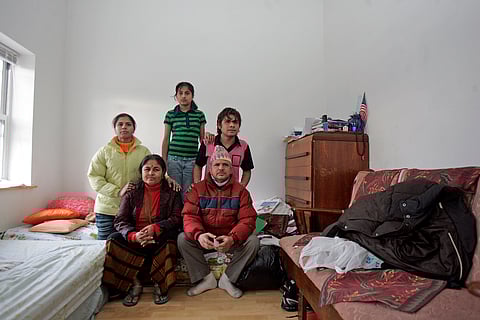 The Kuikel family, ethnic Nepali refugees from Bhutan,  in their house in southern Philadelphia, in the United States, where they resettled after fleeing Bhutan in 1992.