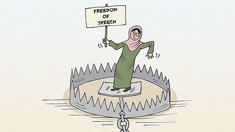  A woman in a hijab stands on a bear trap, holding a 'FREEDOM OF SPEECH' sign, symbolising risks to dissent in India after the Pahalgam attack