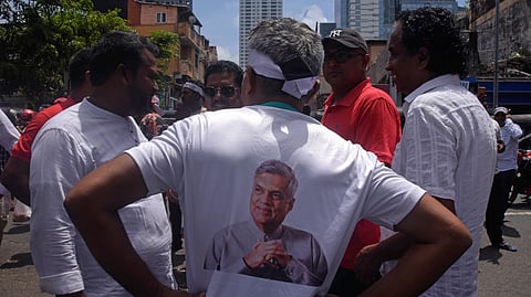 Supporters of the former Sri Lankan president Ranil Wickremesinghe in Colombo protest his arrest under corruption charges. 