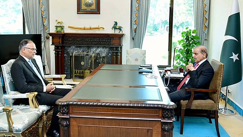 Pakistan’s prime minister, Shehbaz Sharif, with Ahsan Iqbal, the federal minister for planning and development. Iqbal has said that the current resource-sharing formula between the country’s centre and provinces places an undue financial burden on the federal government. 
