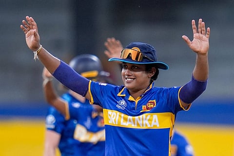 Captain Chamari Athapaththu raises her arms in celebration during the ICC Women’s Cricket World Cup match between Sri Lanka Women and England Women at Premadasa Stadium in Colombo, Sri Lanka, on Saturday, 11 October 2025.