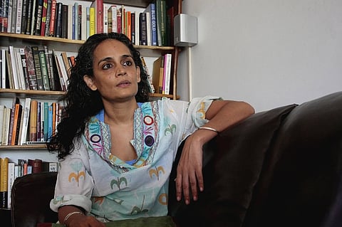 Arundhati Roy at home in Delhi in 2014. [This featured image was added online in 2025 and did not appear in the original print publication.]