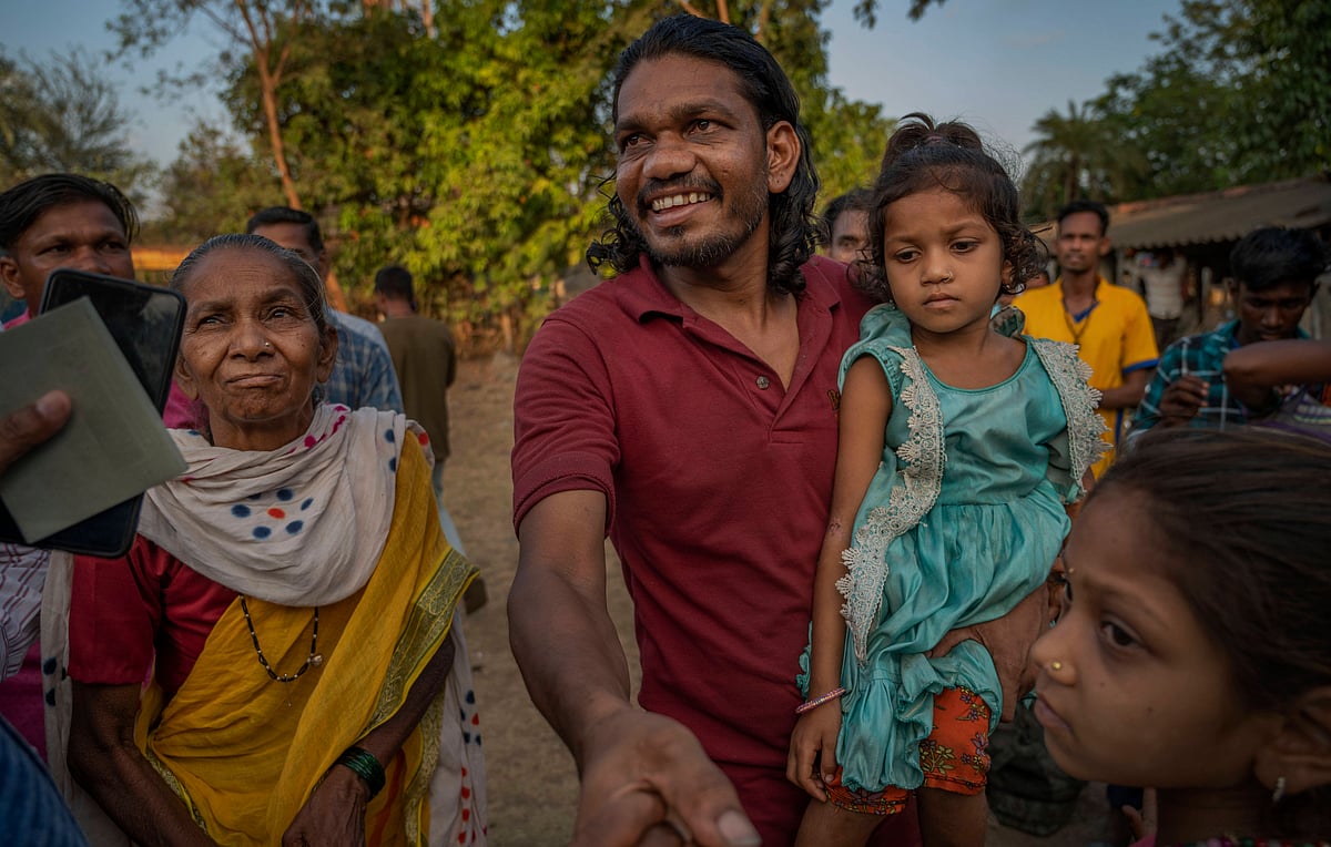 Arjun Daware, a fisherman who returned from Pakistan after three-and-half years breaks down with tears of joy after seeing hi