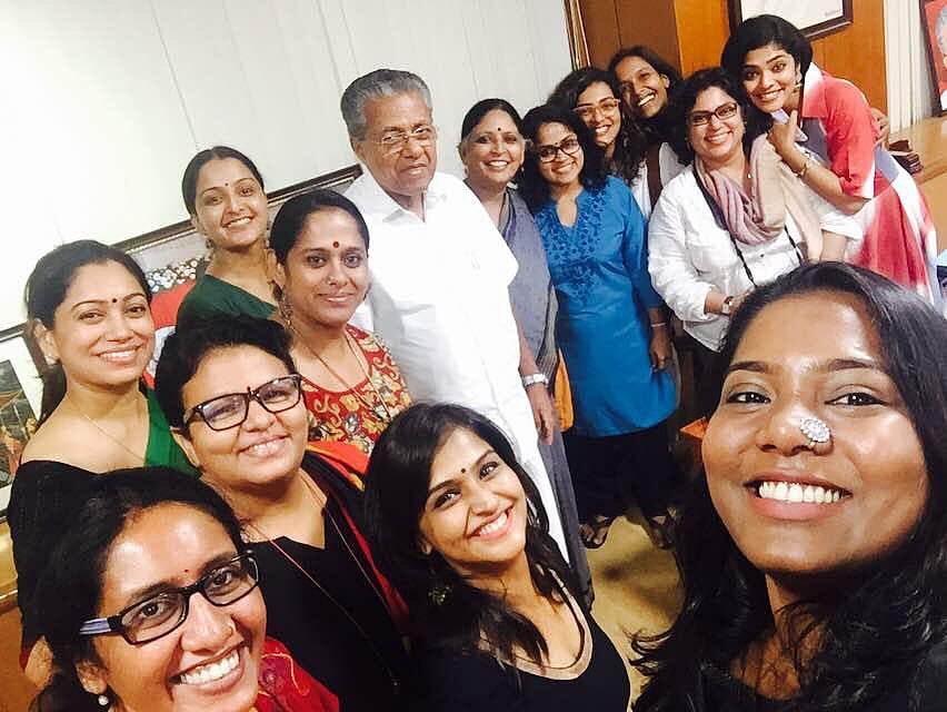 A selfie of 13 women from the Women in Cinema Collective with Kerala’s chief minister Pinarayi Vijayan, who is dressed in a w