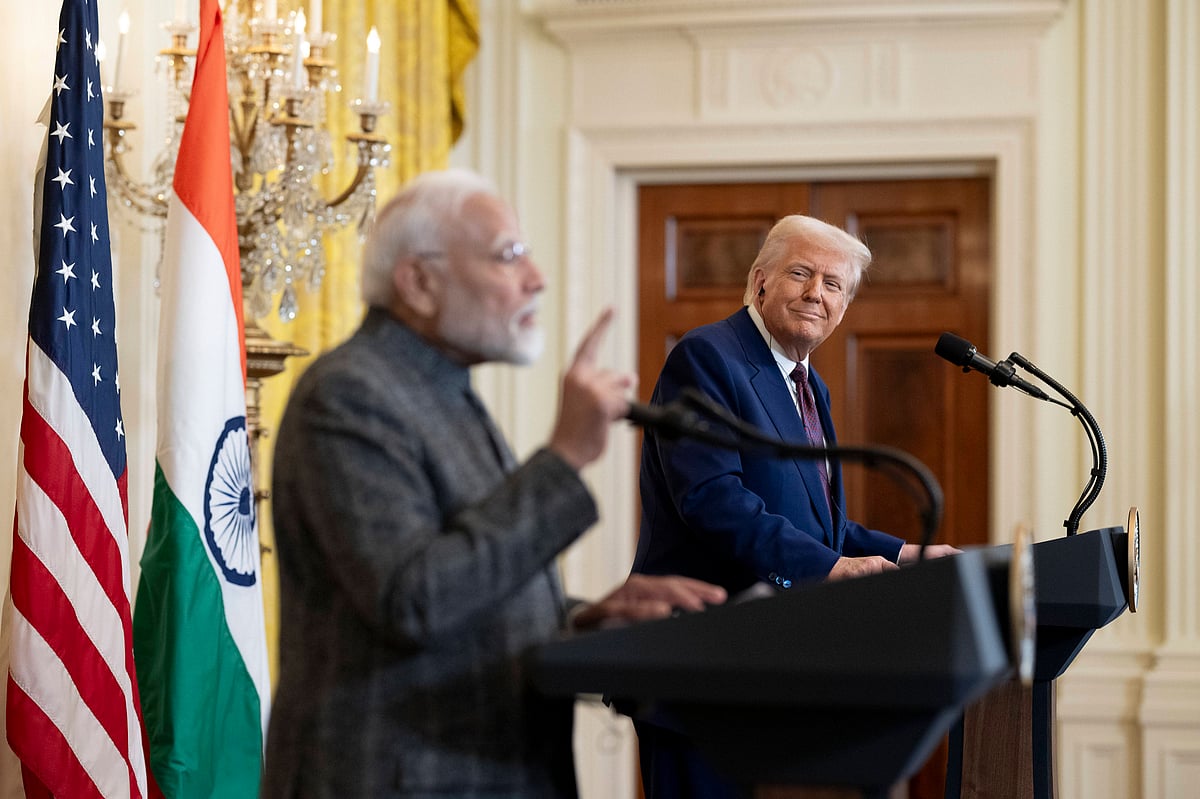US president Donald Trump smiles as he watches India prime minister Narendra Modi taking questions during a joint press confe