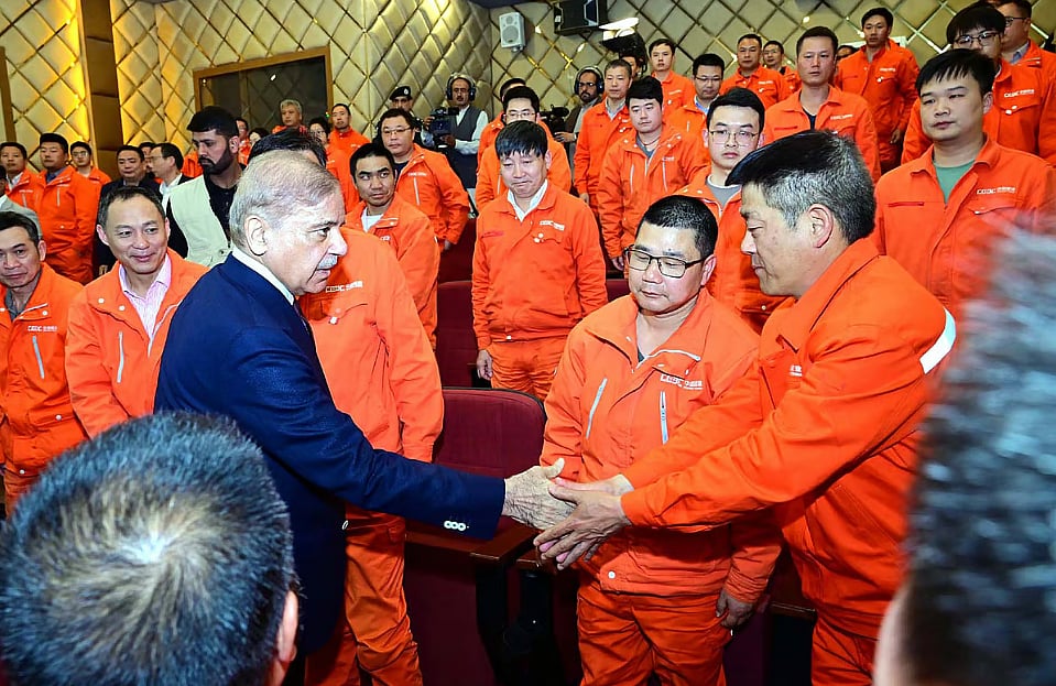 Pakistan’s prime minister Shehbaz Sharif meets Chinese engineers working at the Dasu Hydropower in the northwestern part of the country