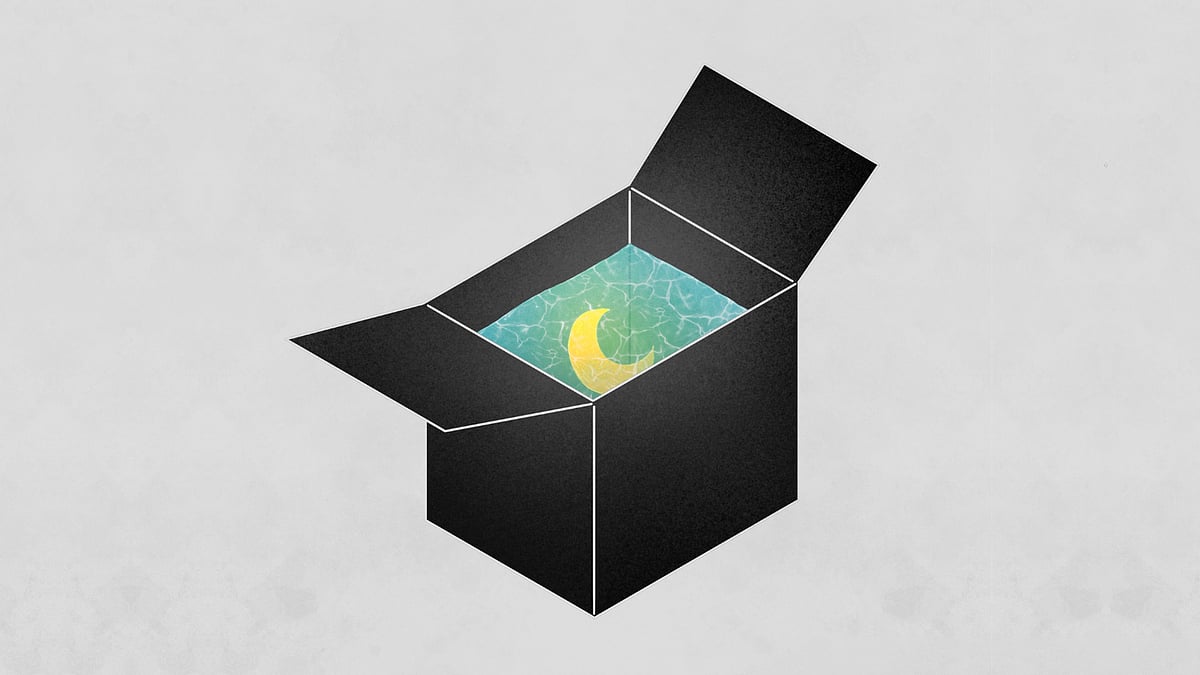 A glowing moon in a black box full of water