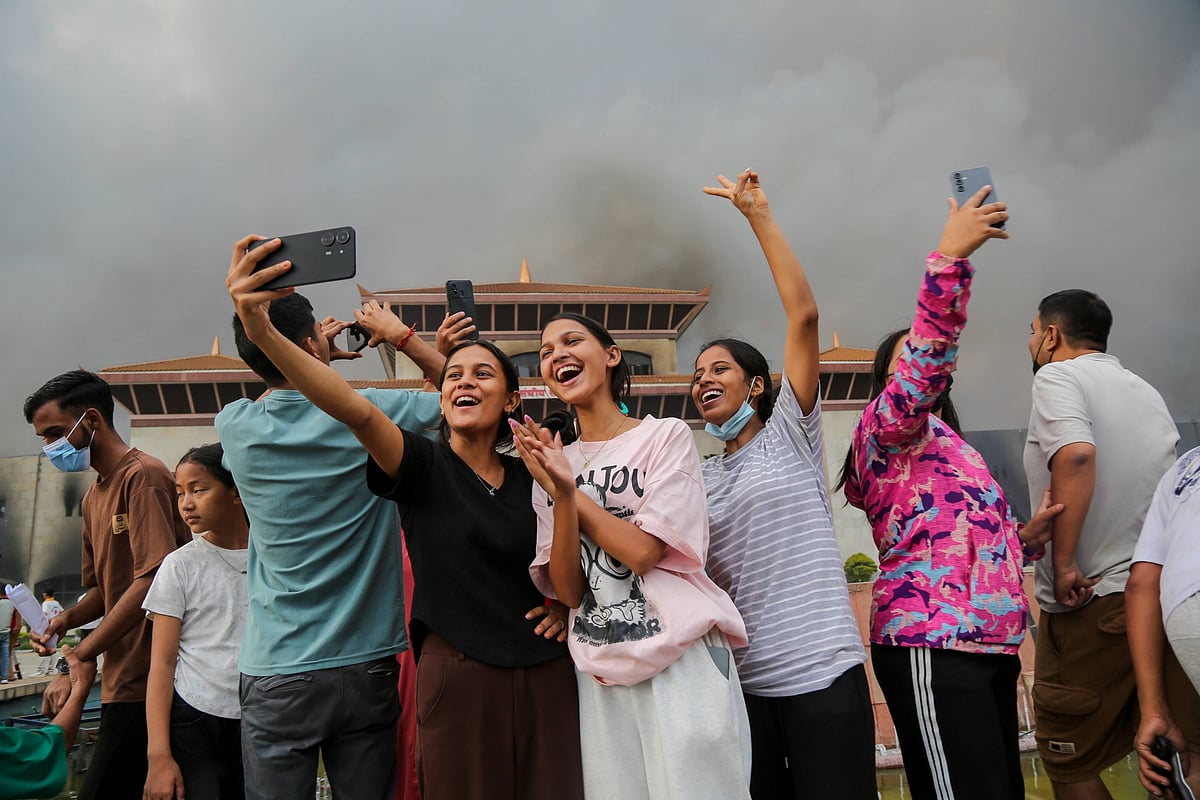 Nepal's young protesters take a photo during the Gen Z protest that led to resignation of K P Sharma Oli
