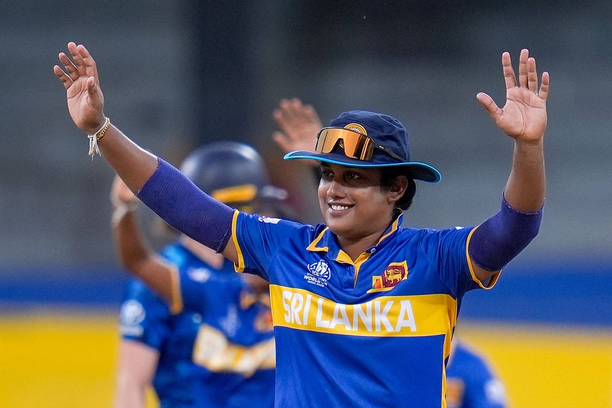 Captain Chamari Athapaththu raises her arms in celebration during the ICC Women’s Cricket World Cup match between Sri Lanka W