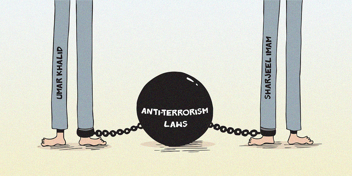 Cartoon of Umar Khalid and Sharjeel Imam's legs chained to a weight that says antiterrorism laws