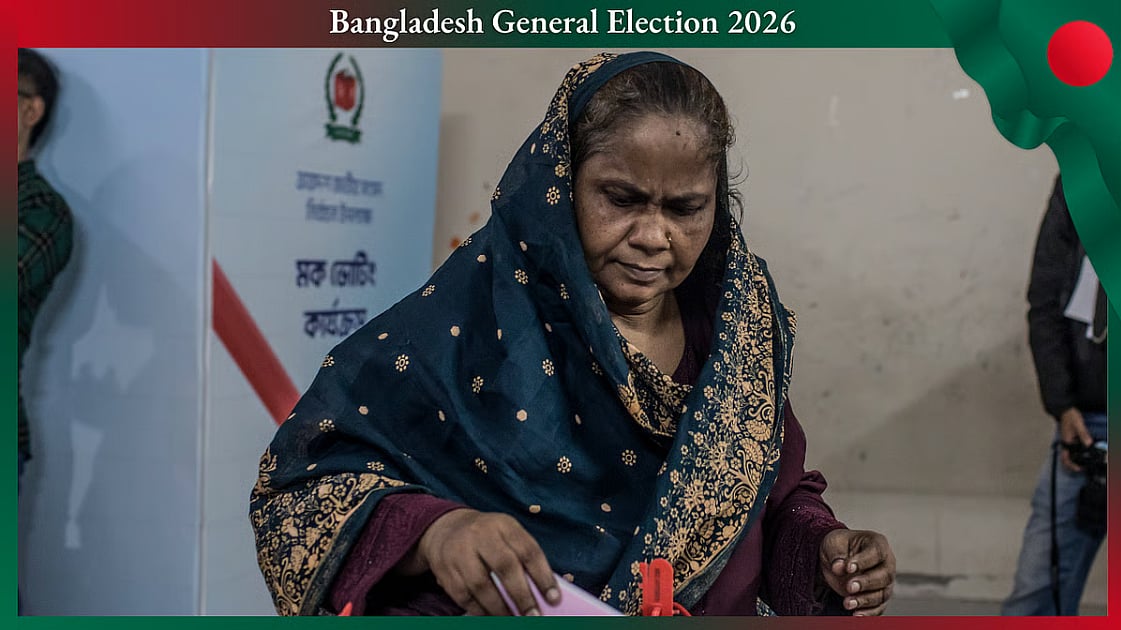 A woman puts her vote into a ballot box during a mock polling exercise in Dhaka, Bangladesh in November 2025