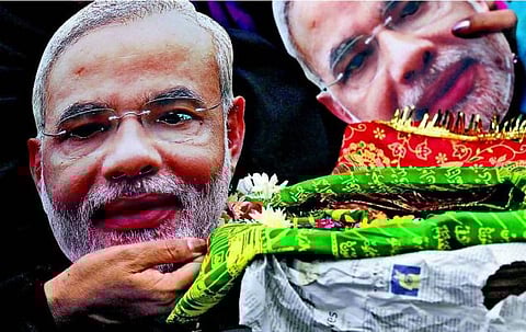 மோடியின் இரு முகங்கள்!