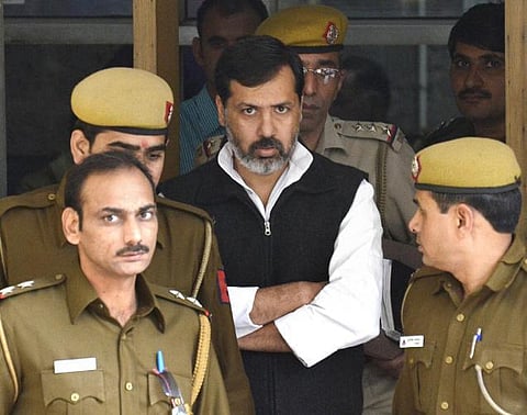 எம்.பி. மீதான பலாத்கார புகாரை வாபஸ் பெற மனைவியை துன்புறுத்திய கணவன்﻿