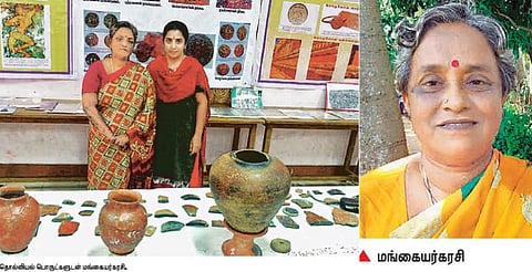 பண்டைய கல்வெட்டுகளை ஆராயும் பெண் ஆராய்ச்சியாளர்