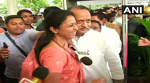 என்சிபி மூத்த தலைவர் அஜித் பவாரை ஆரத் தழுவி அழைத்துச் சென்ற சரத் பவார் மகளும் எம்.பியுமான சுப்ரியா சுலே : படம் ஏஎன்ஐ