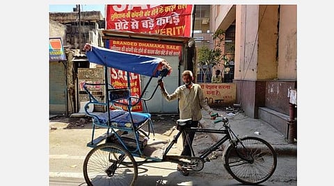 ரிக்‌ஷா ஓட்டுநர் உத்தம் குமார் சிங்.