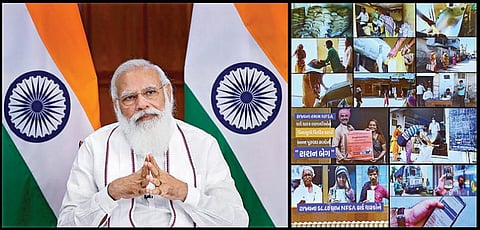 குஜராத் மாநிலத்தைச் சேர்ந்த கரிப் கல்யாண் அன்ன யோஜனா திட்ட பயனாளிகளுடன் பிரதமர் மோடி நேற்று டெல்லியில் இருந்து காணொலிக் காட்சி மூலம் உரையாடினார். படம்: பிடிஐ